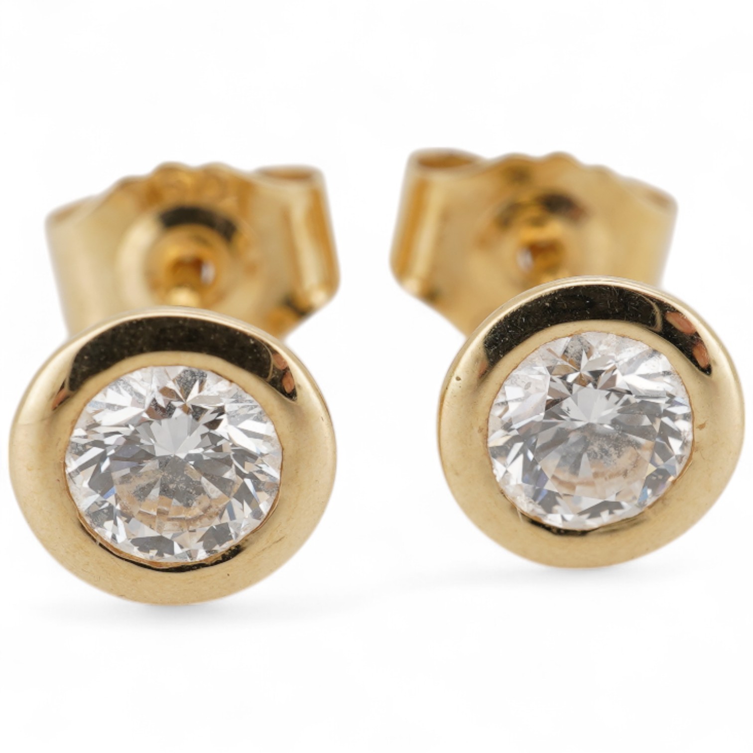 A pair of 18k and solitaire diamond set ear studs, each stone weighing approximately 0.25ct, gross weight 1.5 grams.
